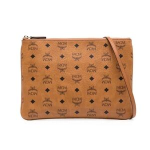 MCM tan and brown leather clutch bag.